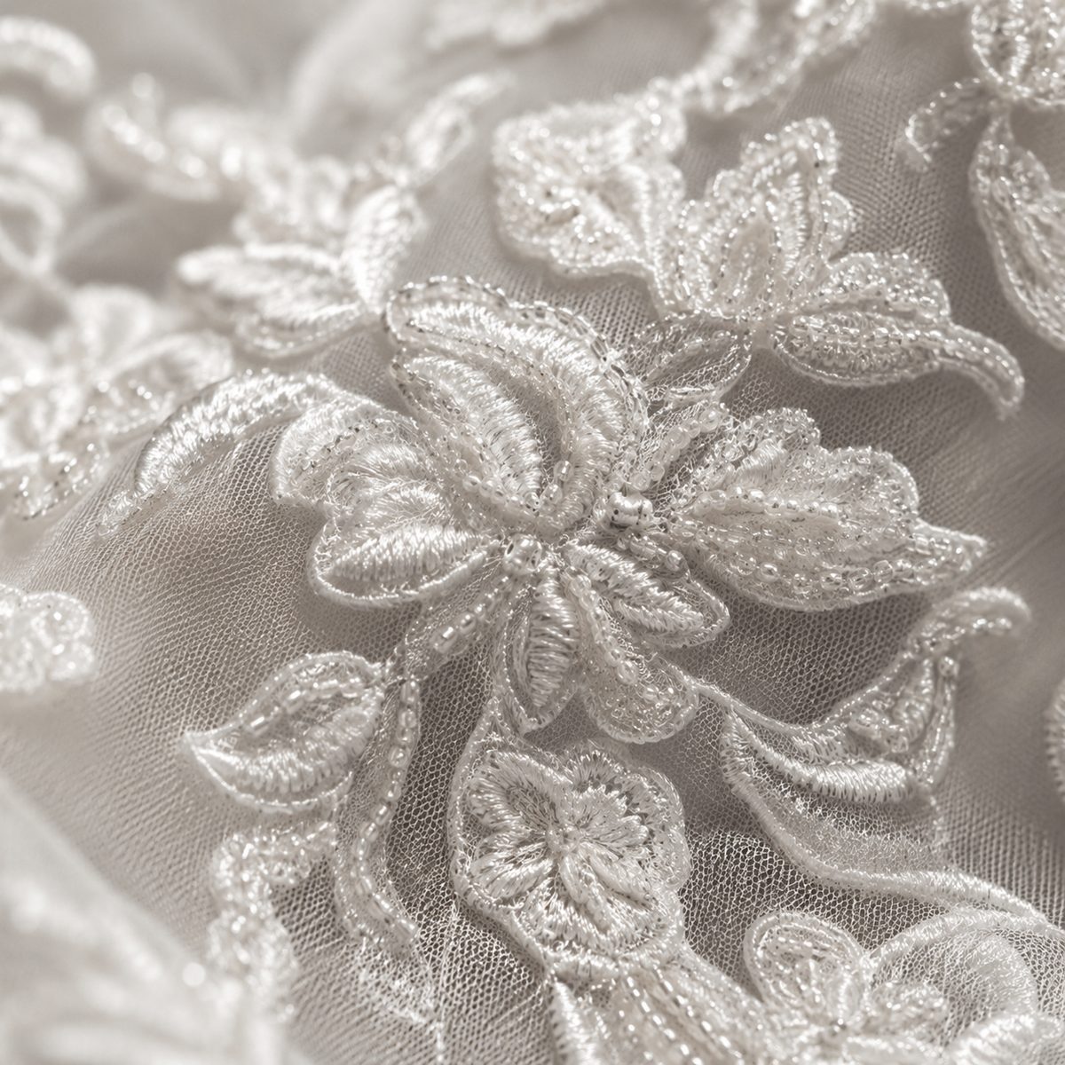 Makro-Detail von Spitze und Perlenstickerei, Atelier Rikelmys